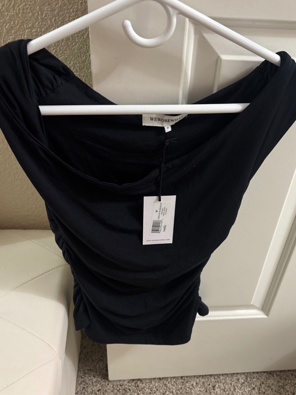 Weworewhat twisted off the shoulder top brand new with the tag size medium